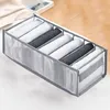 A fabric organizer with multiple compartments filled with rolled-up items, likely clothing or socks. Produktbild-Vorschau