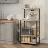 A kitchen scene with a baker's rack holding kitchen appliances and supplies. Produktbild-Vorschau
