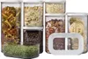 A collection of clear plastic food storage containers filled with various dry goods like pasta, cereal, coffee beans, and herbs, arranged on a white background. Produktbild-Vorschau