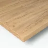 A close-up, angled view of a wooden surface, likely a countertop or shelf, with a visible edge and grain texture. Náhled obrázku produktu