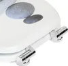 A close-up view of a white toilet seat with a pebble-like design and chrome hinges. Produktbild-Vorschau