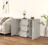 A grey sideboard with drawers and doors is shown in a living room setting next to a sofa. Produktbild-Vorschau