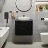A modern bathroom with a black vanity, white sink, bathtub, and toilet. Anteprima dell’immagine prodotto