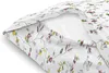 A close-up view of a white pillow with a floral pattern. Produktbild-Vorschau