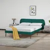 A bedroom scene with a green bed, nightstands, and a rug. Produktbild-Vorschau