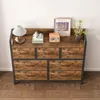 A dresser with drawers is shown in a room with a wooden floor and a white wall. Náhled obrázku produktu