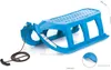 A blue plastic sled with a rope and handle, shown on a white background. Produktbild-Vorschau
