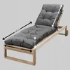 A grey cushion on a wooden sun lounger, with dimensions indicated by arrows and text. Produktbild-Vorschau