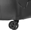 A close-up view of the bottom corner of a black suitcase, showing one of its wheels. Produktbild-Vorschau