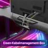 The back of a desk with cables being managed by a box, with colorful lighting in the background. Voir les images du produit