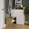 A hallway or entryway with a shoe cabinet and bench, coats hanging on the wall, and a door. Náhľad obrázku produktu