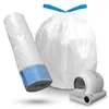 A roll of white trash bags with blue accents and a large white trash bag tied with blue ribbon, next to a white automatic cat litter box. Produktbild-Vorschau