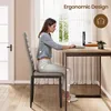 A woman is sitting at a desk using a laptop, demonstrating ergonomic posture. Produktbild-Vorschau
