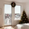 A bedroom decorated for Christmas with a decorated Christmas tree and window decorations. Produktbild-Vorschau