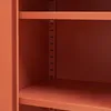 A close-up view of the interior of a metal cabinet, showing shelves and support posts. Voir les images du produit