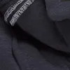 A close-up view of black fabric with visible stitching. Produktbild-Vorschau