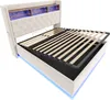 A modern bed frame with a tufted headboard and built-in shelving, illuminated by LED lights. Náhled obrázku produktu