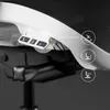 Close-up of the control panel and adjustable armrests of a white and black ergonomic office chair. Voir les images du produit