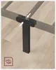 Close-up of a bed frame leg being attached to the frame with arrows indicating connection points. Náhled obrázku produktu