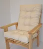 A close-up view of a beige cushion on a wooden chair. Produktbild-Vorschau