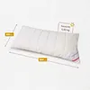 A white pillow is shown on a light gray textured background. Produktbild-Vorschau