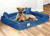 A dog is lying on a blue dog bed in a room with wooden floors. Voir les images du produit