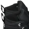 A close-up view of the interior lining and eyelets of black Converse boots. Produktbild-Vorschau