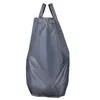 A gray fabric bag with handles, standing upright against a white background. Produktbild-Vorschau