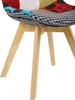 A close-up view of the seat and legs of a colorful patchwork chair. Produktbild-Vorschau