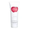 A white tube of Nina Ricci Nina Creamy Body Lotion with a red apple logo. Náhľad obrázku produktu