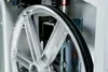 Close-up of a metal wheel with a black rubber band on a bandsaw. Anteprima dell’immagine prodotto