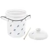 A white ceramic fermentation pot with blue floral accents, a lid, and a wooden stirring stick, presented on a white background. Náhled obrázku produktu