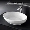 A white oval vessel sink with water swirling inside, placed on a dark vanity with a chrome faucet above it. Produktbild-Vorschau