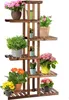 A wooden plant stand with multiple tiers holding various potted plants. Produktbild-Vorschau