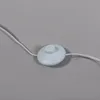 A close-up of a white foot switch on a white cord against a gray background. Produktbild-Vorschau
