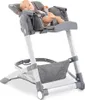 A baby is sitting in a high chair. Produktbild-Vorschau