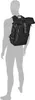 A mannequin wearing a black backpack.