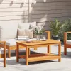 An outdoor patio setting with wooden furniture and string lights. Podgląd zdjęcia produktu