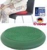 A collage showing a person sitting on a chair with a red balance cushion and a separate green balance cushion. Produktbild-Vorschau