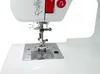 A close-up view of the needle and presser foot area of a white sewing machine. Produktbild-Vorschau