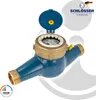 A water meter with a blue body and gold accents, shown against a white and light gray background with graphic elements. Produktbild-Vorschau