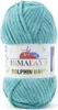 A ball of turquoise yarn with a label. Produktbild-Vorschau