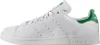 A side view of a white Adidas Stan Smith sneaker with green accents. Náhled obrázku produktu