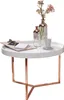 A white round coffee table with copper legs, decorated with two glass vases and a cup. Podgląd zdjęcia produktu