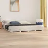 A white bed frame with a mattress and pillows in a bedroom. Produktbild-Vorschau