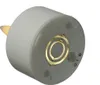 The bottom of a white LED tea light is shown against a white background. The metal contacts for charging are visible in the center. Produktbild-Vorschau