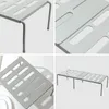 A collage of four images showing different angles of a gray metal shelf organizer. Podgląd zdjęcia produktu