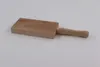 A wooden gnocchi board with a handle, placed on a light gray background. Produktbild-Vorschau