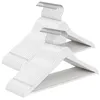 A stack of white wooden hangers with silver hooks. Produktbild-Vorschau