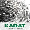 A close-up of a roll of barbed wire with the brand logo and name at the bottom. Produktbild-Vorschau
